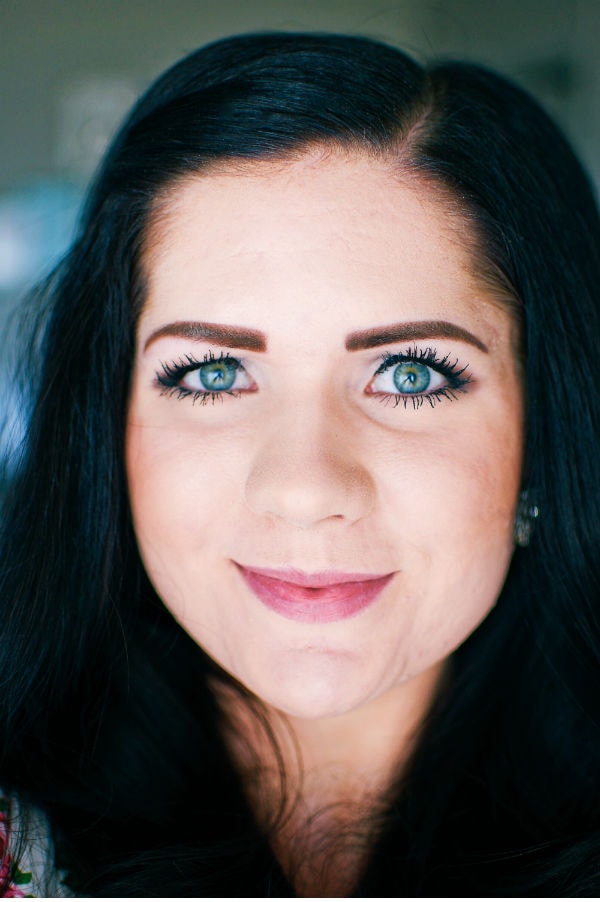 Woman shows off eyelash enhancing serum results