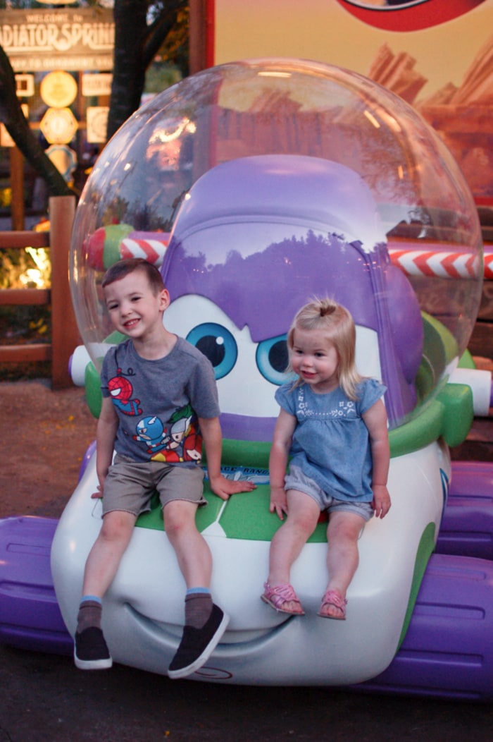 Two kids smile in Disneyland during Pixar Fest!