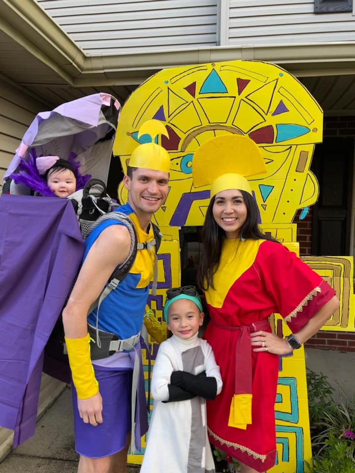 Family dressed in Emperor's New Groove costumes.