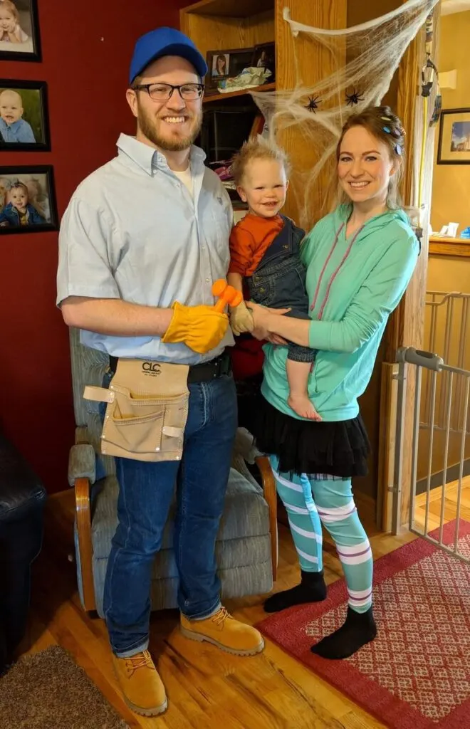 Family of 3 wearing Wreck It Ralph costumes.