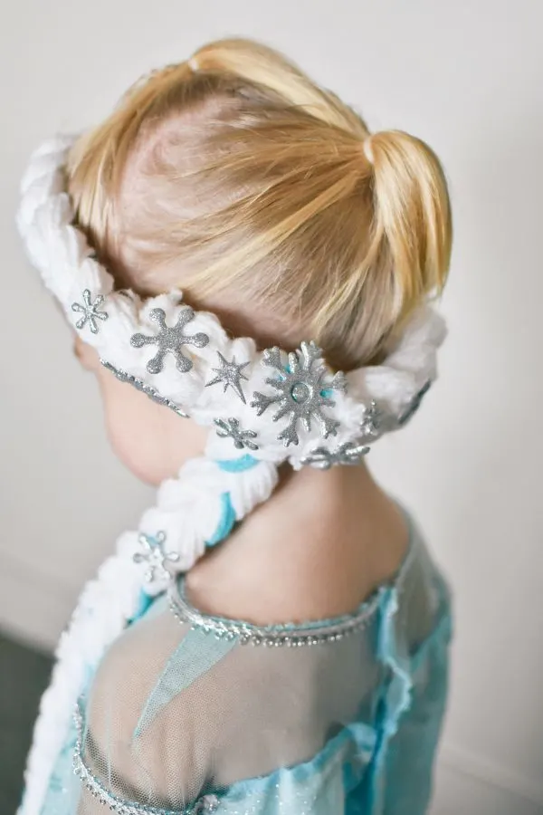 Toddler girl wears an Elsa braid