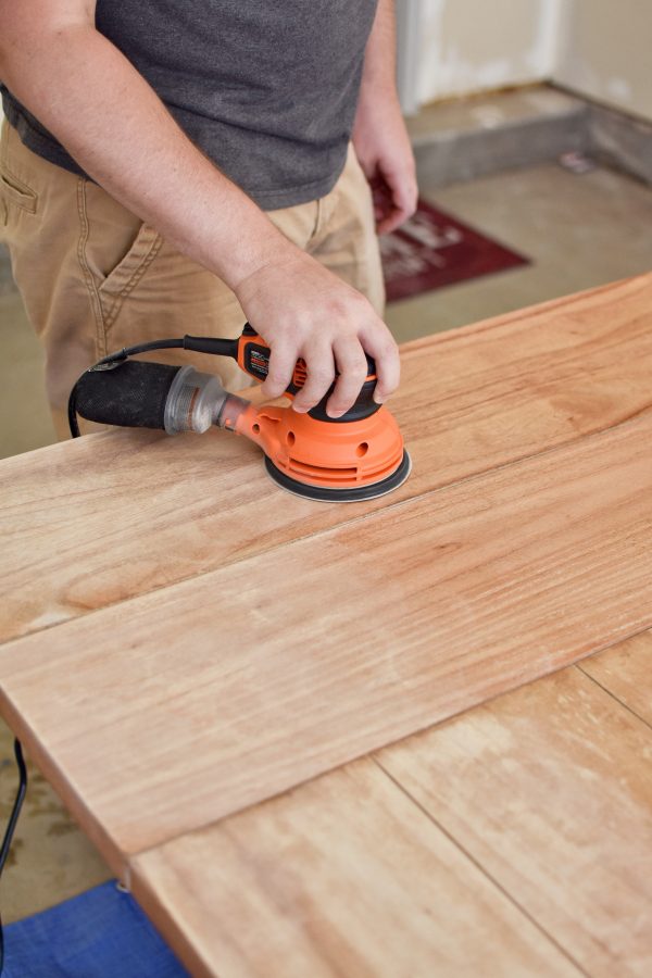 Refinishing a table with an orbital sander