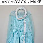 Pinterest graphic with text and an Elsa costume on a hanger with a yarn hair braid.