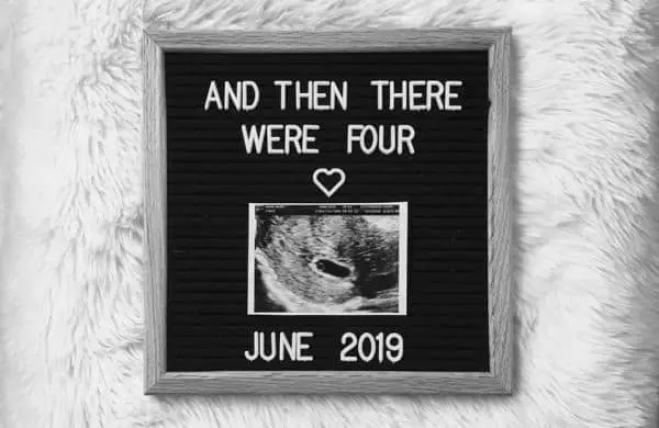 Family uses letterboard to announce another baby