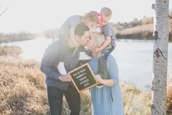 Family uses letterboard to announce another baby