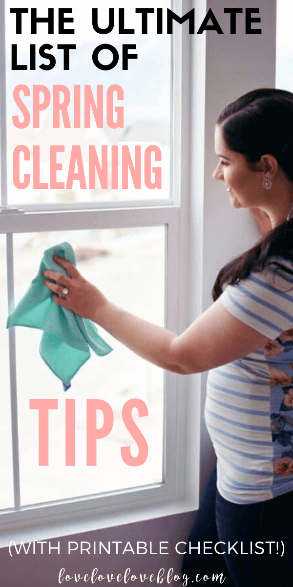 Pinterest graphic with text that reads "The Ultimate List of Spring Cleaning Tips" and a woman cleaning a window.