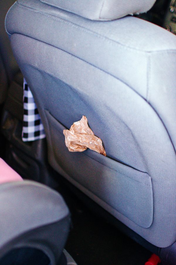 Plastic bag in a car seat organizer.