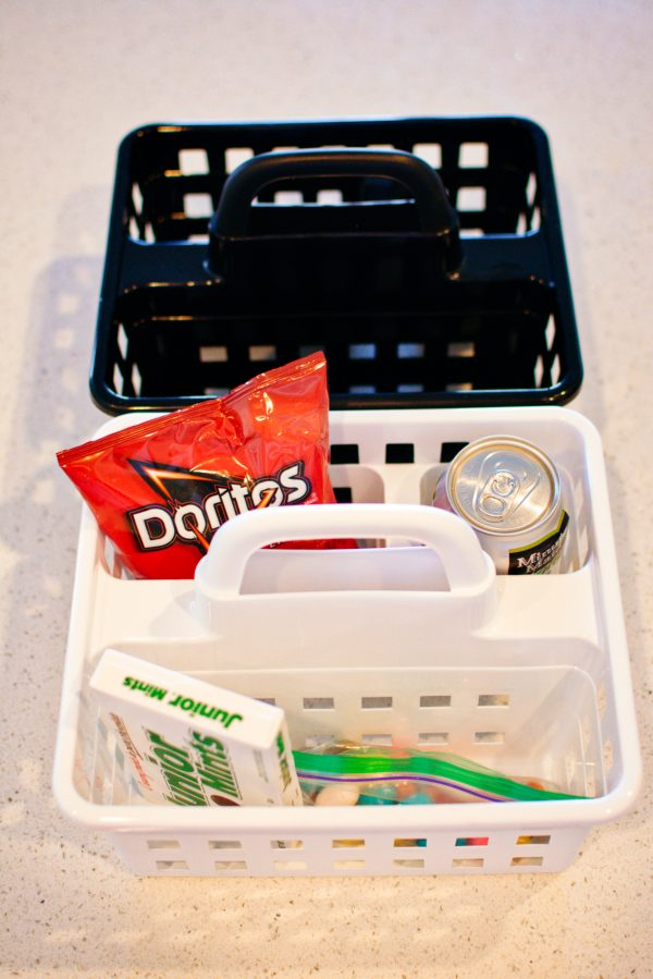 Shower caddies filled with snacks. 