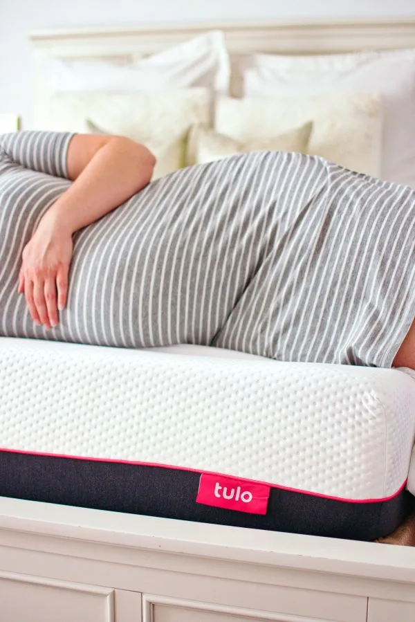 A mom to be on her tulo mattress.