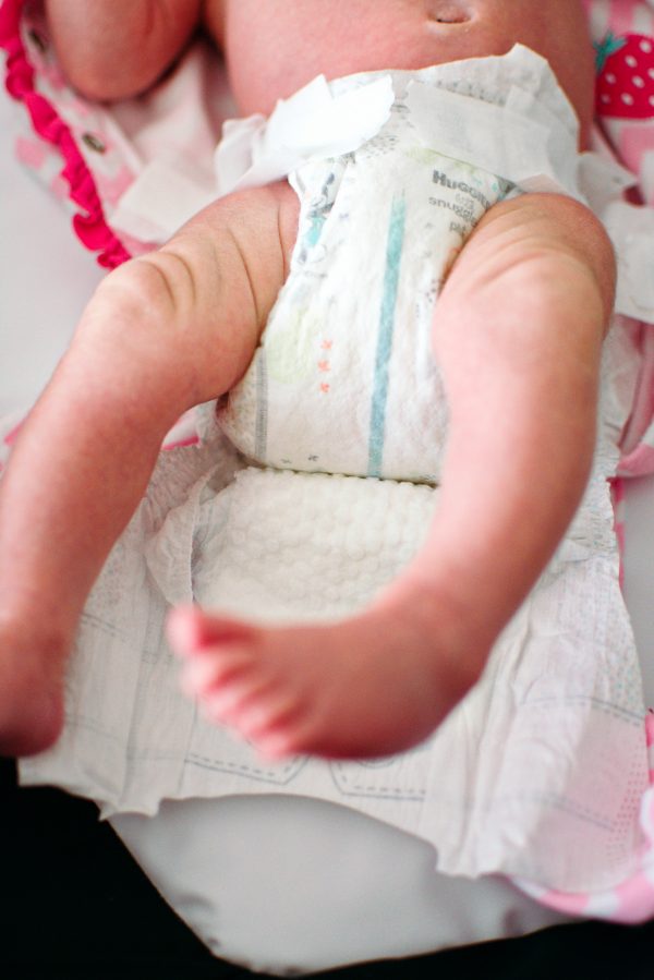 Putting a clean diaper under baby is one of the best DIY baby hacks.