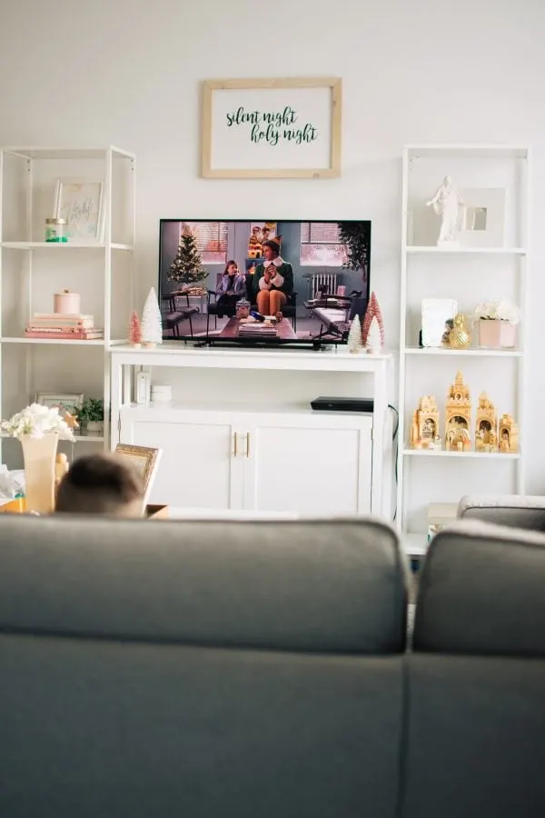 Boy watches Christmas classics on the TV as part of his family's Christmas traditions.