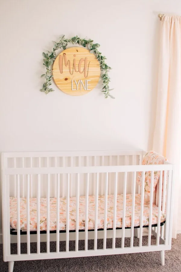 Baby girl crib and name sign.
