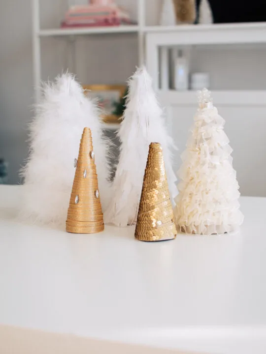 DIY cone Christmas trees on a table.