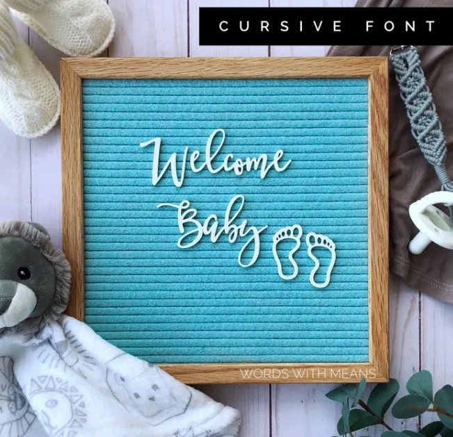 Cursive welcome baby saying on a blue letter board.