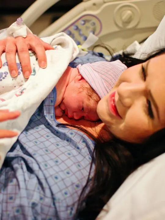 Mom and newborn in hospital bed.