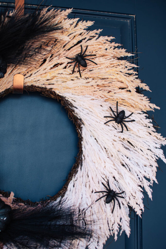 Boho Halloween wreath with glitter spiders.