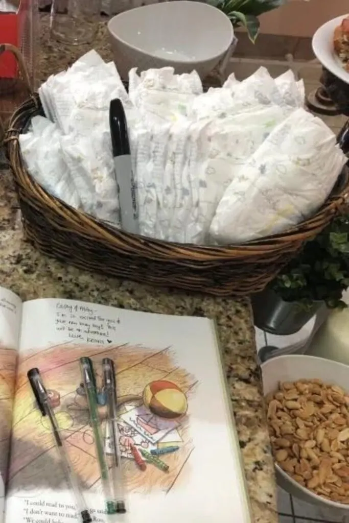 Baby diapers in a basket with a black sharpie marker.