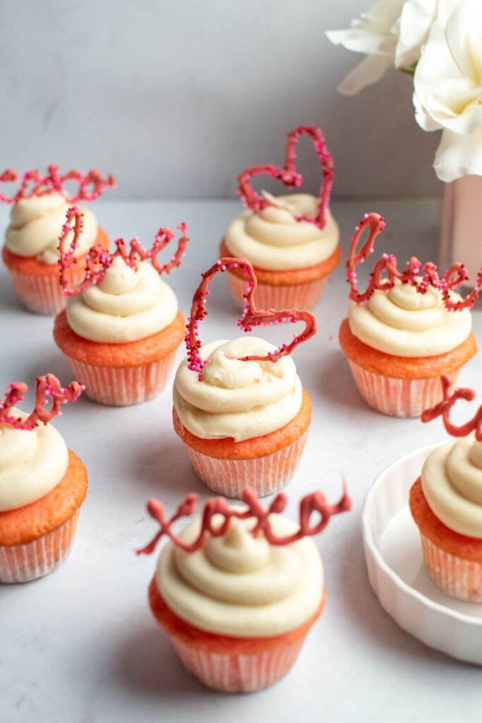 Valentine's Day pink cupcakes with pink cupcake toppers.